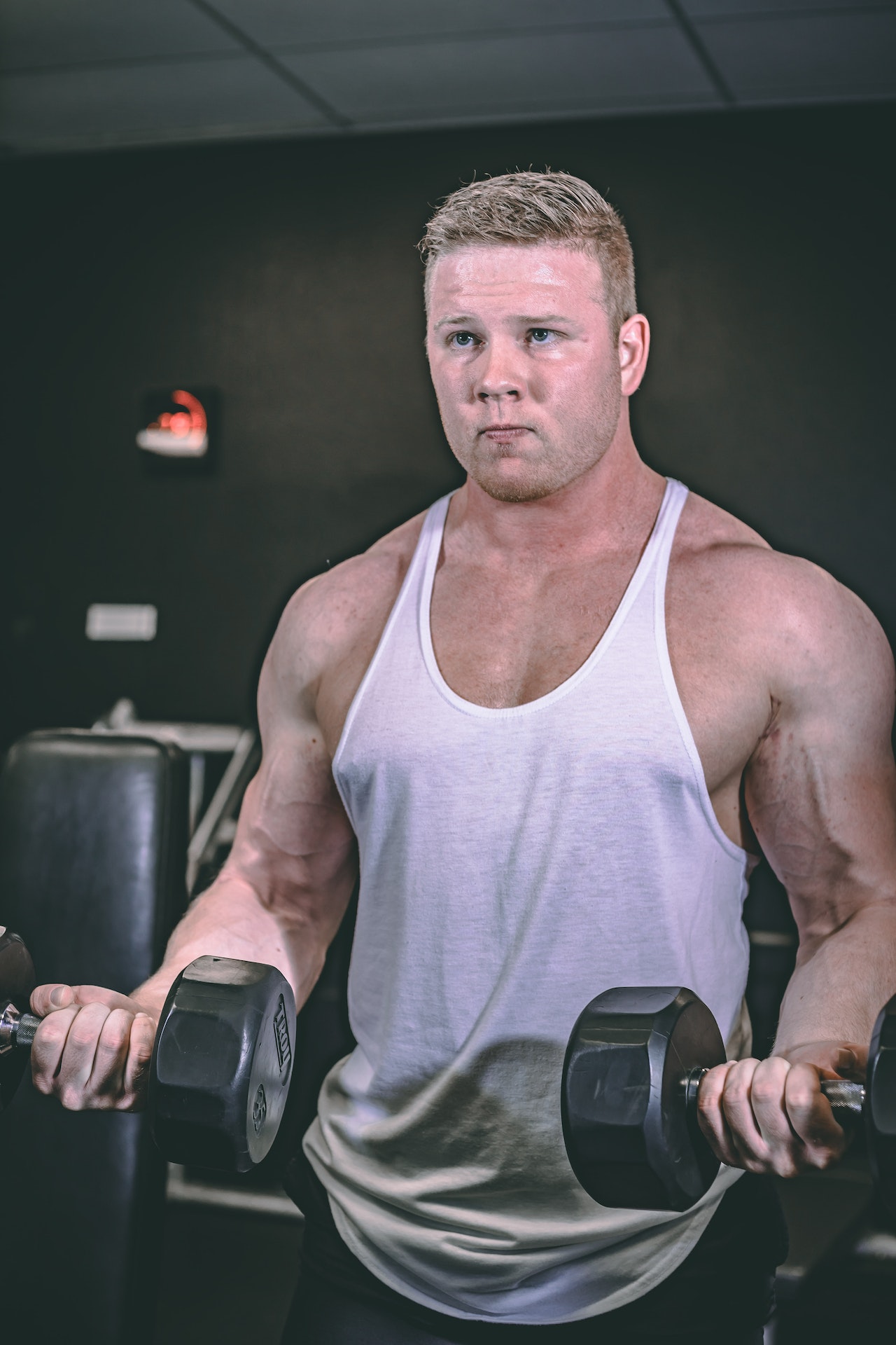 a man curling dumbbells