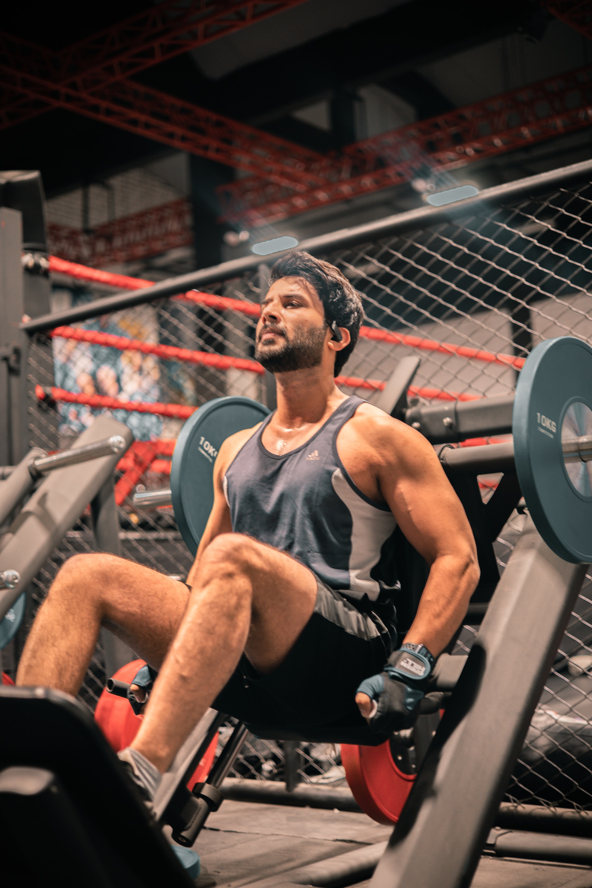 a man using a hacksquat machine